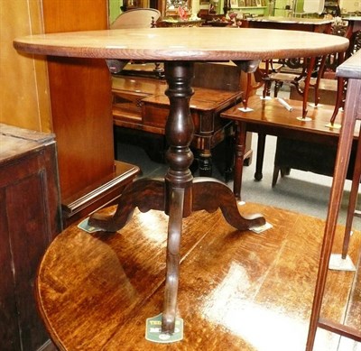 Lot 527 - Georgian oak tripod table