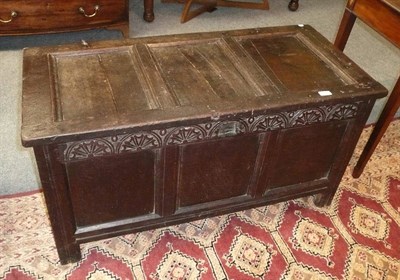 Lot 548 - A late 18th century carved oak three panel coffer