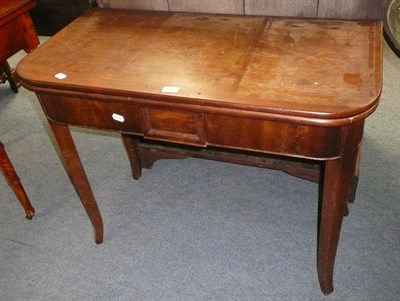 Lot 551 - A 19th century mahogany fold-over tea table