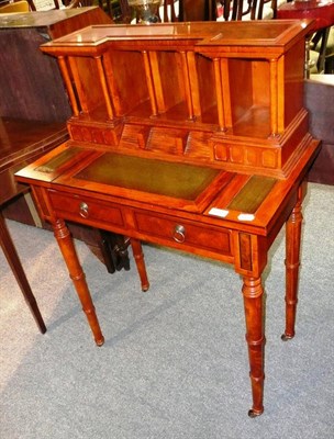 Lot 552 - Modern reproduction yew writing table