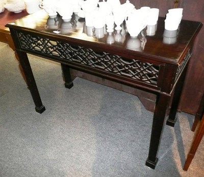 Lot 553 - Mahogany hall table with fret carved panelling