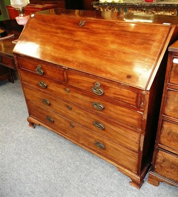 Lot 556 - A George III mahogany bureau desk