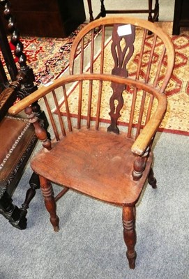 Lot 560 - An ash and elm Windsor armchair with crinoline stretcher