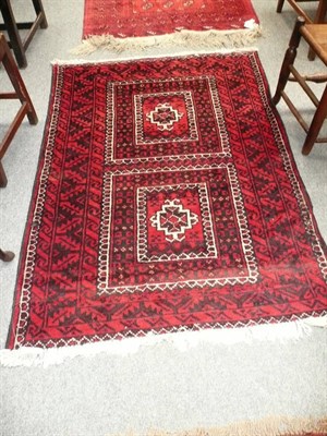 Lot 565 - Belouch rug of Turkman design Persian/Afghan frontier  The field with twin panels containing hooked