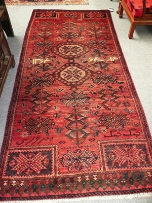 Lot 578 - Kurdish rug West Persia The shaded field with twin medallions 280 x 130 cm