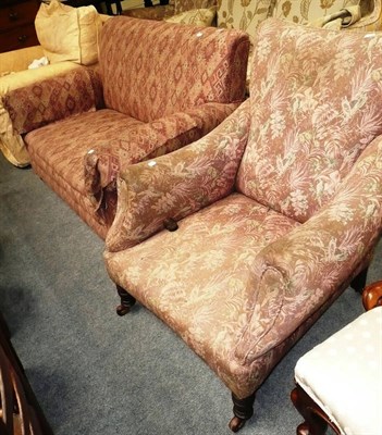 Lot 592 - A Victorian upholstered armchair and a two seater sofa