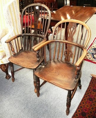 Lot 594 - A 19th century low back ash and elm Windsor armchair and another with crinoline stretcher