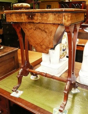 Lot 604 - A Victorian walnut sewing table