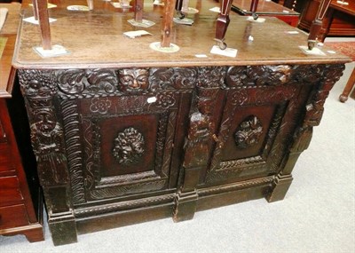 Lot 605 - 19th century heavily carved oak two door sideboard