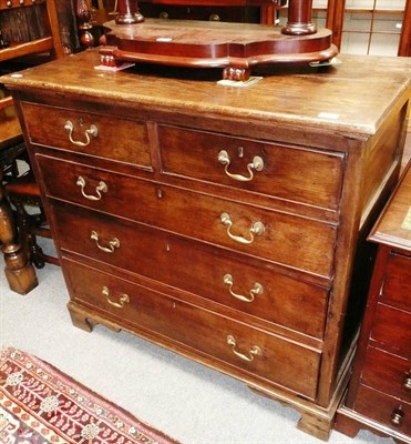 Lot 606 - Oak chest of two short and three long drawers