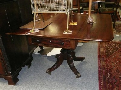 Lot 625 - A 19th century pedestal Pembroke table with refinished top