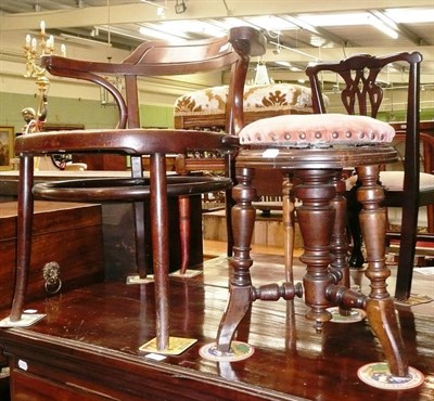 Lot 627 - A revolving piano stool and a bergère chair