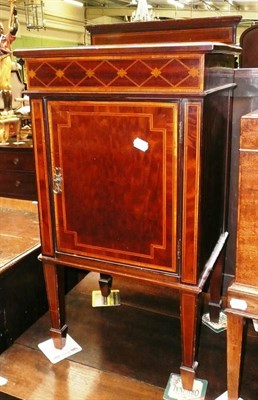 Lot 630 - An Edwardian inlaid bedside cabinet