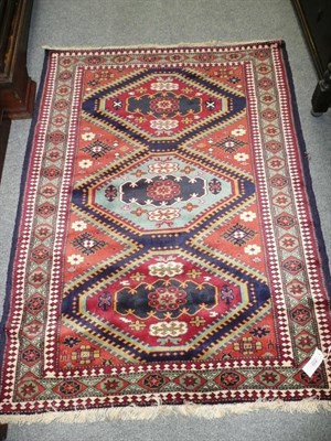 Lot 633 - Kazak design rug Probably West Turkey - The polychrome field with three linked stepped...