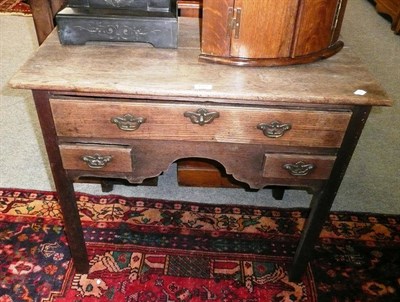 Lot 653 - 18th century oak lowboy