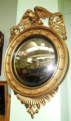 Lot 655 - A gilt Regency style convex wall mirror