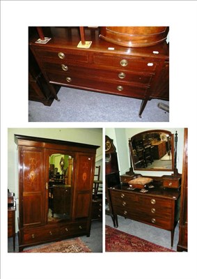 Lot 662 - An Edwardian inlaid mahogany bedroom suite comprising of a wardrobe, chest of drawers, dressing...