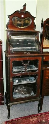 Lot 666 - An Edwardian mahogany glazed cabinet with mirrored top