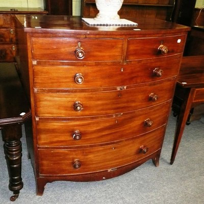 Lot 672 - A Victorian mahogany five height bow front chest of drawers