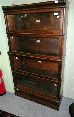 Lot 681 - An oak four height Globe Wernicke style bookcase