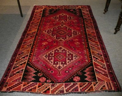 Lot 691 - Kashgai rug South West Persia, the field with three diamond medallions 237 x 150 cm