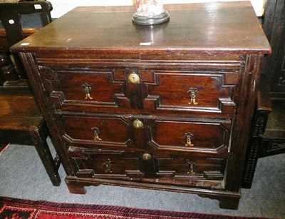 Lot 696 - A late 17th century oak three height chest with moulded drawers (alterations)