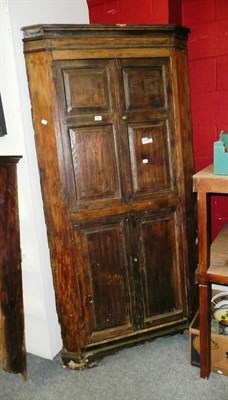 Lot 757 - A Georgian oak standing corner cabinet