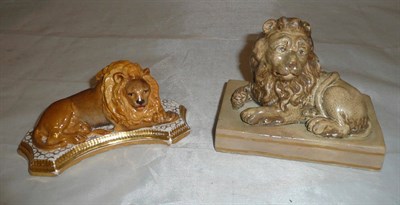 Lot 8 - An English porcelain recumbent lion with a shaped and gilded base circa 1830 and a Wood &...