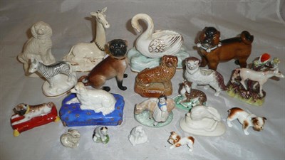 Lot 11 - A group of nineteen ceramic animal figures including a Staffordshire porcelain recumbent...