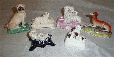 Lot 12 - Six assorted pottery and porcelain models of dogs