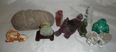 Lot 13 - A Chinese carved rock crystal Fo dog (A.F); a Soapstone Fo dog seal; two carved stone Buddhas...