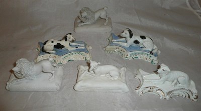 Lot 21 - A matched pair of English porcelain recumbent black and white dogs; a pair of Chamberlains...