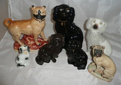 Lot 24 - Seven assorted late Victorian ceramic dog figures