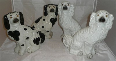 Lot 34 - Two pairs of Staffordshire pottery dogs (4)