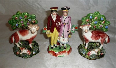 Lot 40 - A Staffordshire pottery courting couple group probably circa 1920 and a pair of 20th century...