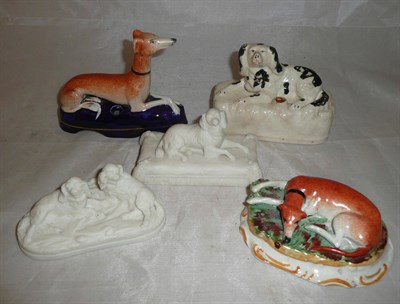 Lot 44 - Two Parian Spaniel groups; two pottery dog inkwells/ pen stands and a recumbent Greyhound...