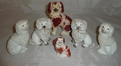 Lot 46 - Two pairs of Staffordshire pottery Poodles and two Staffordshire Spaniels (6)