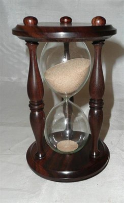 Lot 58 - A rosewood framed hour glass