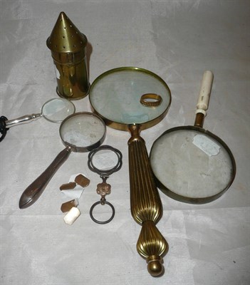 Lot 69 - Five assorted magnifying glasses, including one with silver filled handle; a gilt metal scarf ring