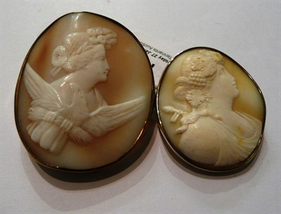 Lot 170 - Two cameo brooches, one depicting Bacchus, one with an eagle, both in plain frames, worn