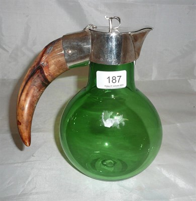 Lot 187 - A Victorian green claret jug with warthog tusk handle