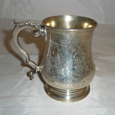 Lot 190 - A Victorian mug, Lias Brothers, London 1876, of baluster form with cast leaf capped scroll...