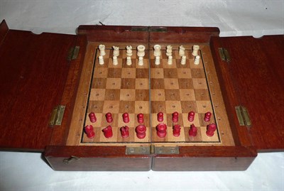 Lot 194 - A Jacques portable chess set with stained ivory figures