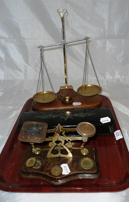 Lot 223 - A brass and oak beam scale, a set of postal scales and a glove box