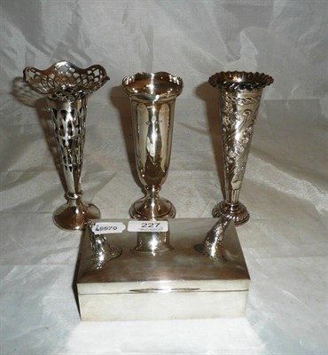 Lot 227 - Three silver bud vases and a silver cigarette box