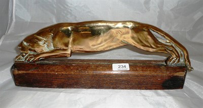 Lot 234 - A brass model of a big game cat on a wooden base