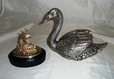 Lot 250 - A filled silver model of a swan and a model of a Viking ship stamped '925'