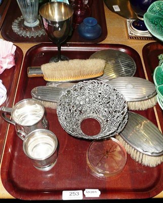 Lot 253 - A tray of silver including a wine cup, two mugs, dressing table items etc