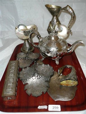 Lot 259 - An plated teapot, and a collection of white metal and silver items including an Indian white...