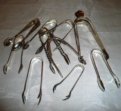 Lot 274 - Ten pairs of silver sugar tongs including a "wish bone" example